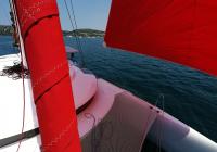 trimaran neel 45 yacht bow roll genoa sail gennaker
